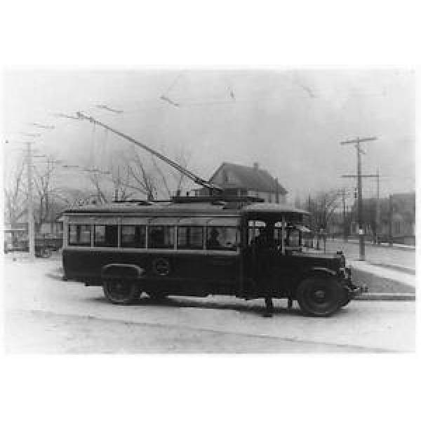 Man,trackless trolley car,bus,bearing insignia,Rochester Railway Bus Lines,c1920 #1 image